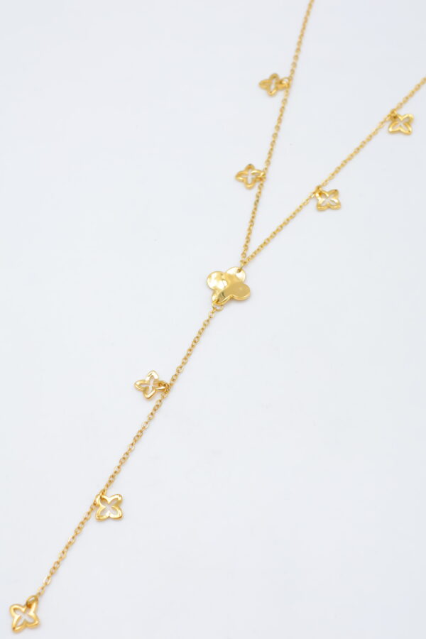 Collier doré pendentif long trèfles ajourés