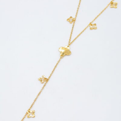 Collier doré pendentif long trèfles ajourés