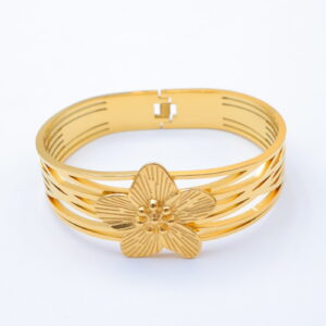 Bracelet jonc doré à large fleur ciselée